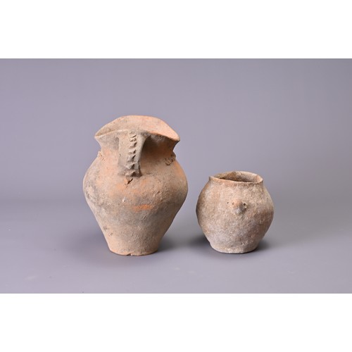 191 - TWO CHINESE NEOLITHIC POTTERY JARS. To include a Siwa pottery jar with saddle like rim and two stap ... 