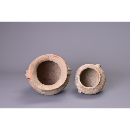 191 - TWO CHINESE NEOLITHIC POTTERY JARS. To include a Siwa pottery jar with saddle like rim and two stap ... 