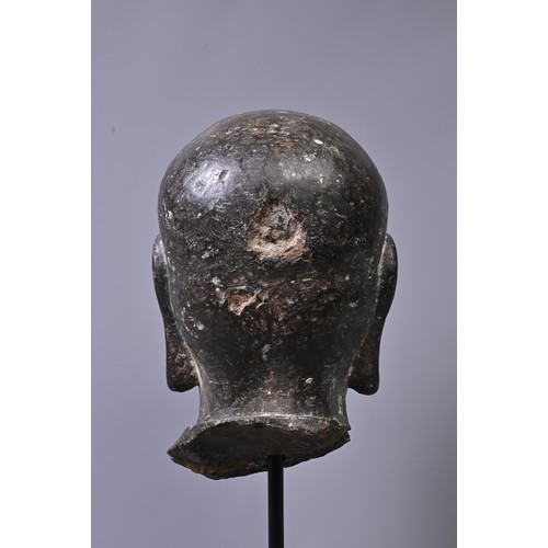 192 - A CHINESE CARVED STONE HEAD OF LUOHAN. Dark heavy grey stone with well carved features, deep lines t... 