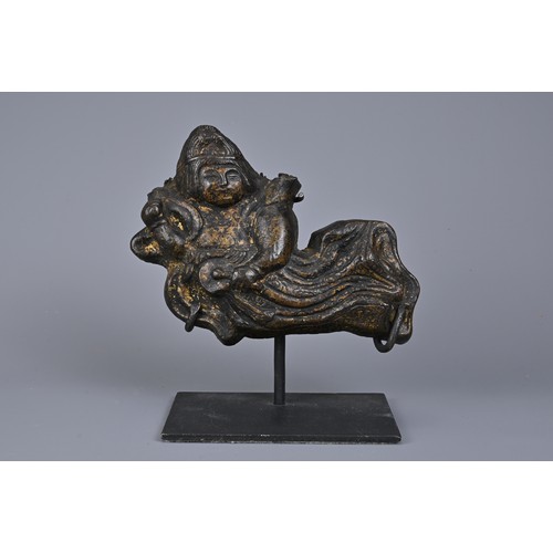 41 - A CHINESE CAST BRONZE FIGURE OF APSARA. The flying female spirit dressed in robes playing a drum. Wi... 