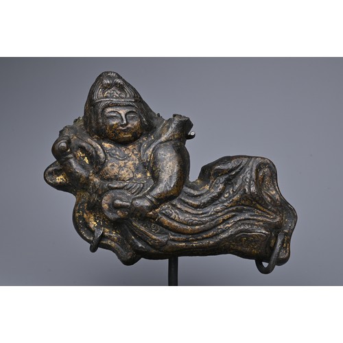 41 - A CHINESE CAST BRONZE FIGURE OF APSARA. The flying female spirit dressed in robes playing a drum. Wi... 