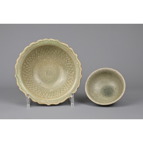 104 - TWO SOUTH EAST ASIAN CELADON POTTERY ITEMS, 14/15TH CENTURY. To include a bowl with bracket lobed ri... 