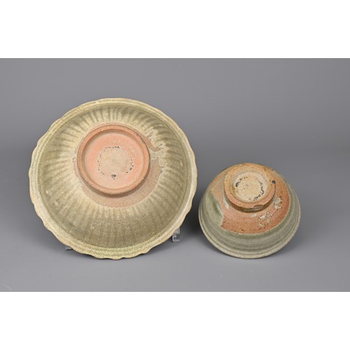 104 - TWO SOUTH EAST ASIAN CELADON POTTERY ITEMS, 14/15TH CENTURY. To include a bowl with bracket lobed ri... 