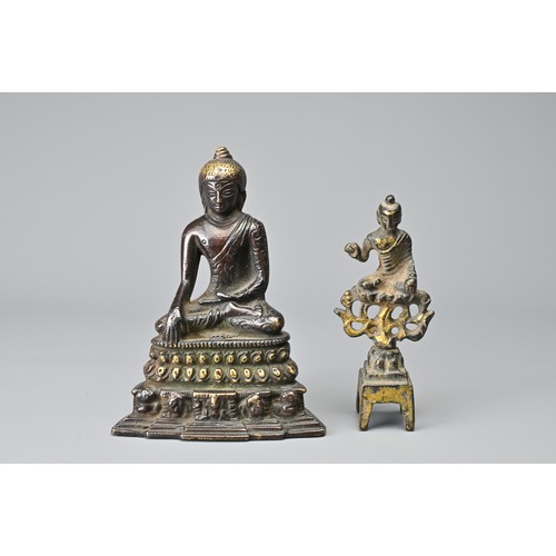 32 - TWO CHINESE / BURMESE BRONZE DEITY FIGURES. To include a seated figure of Buddha on a lotus pedestal... 