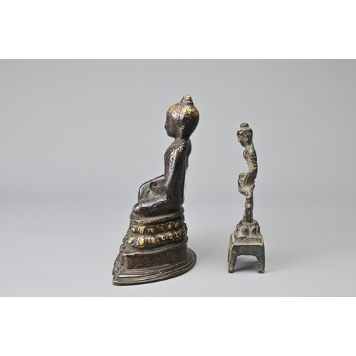 32 - TWO CHINESE / BURMESE BRONZE DEITY FIGURES. To include a seated figure of Buddha on a lotus pedestal... 