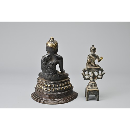 32 - TWO CHINESE / BURMESE BRONZE DEITY FIGURES. To include a seated figure of Buddha on a lotus pedestal... 