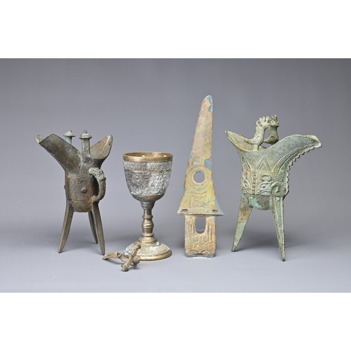 37 - A GROUP OF BRONZE ITEMS. To include two Chinese archaic stye bronze ritual tripod vessels, Jue; A Ch... 