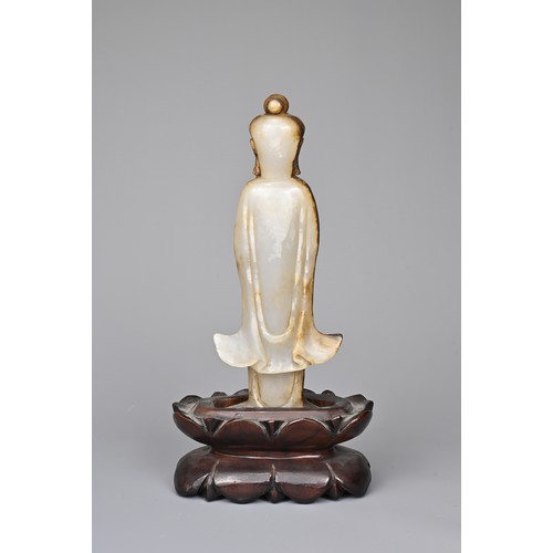 39 - A CHINESE AGATE CARVING OF A STANDING BUDDHA, QING DYNASTY. The figure standing in flowing robes hol... 