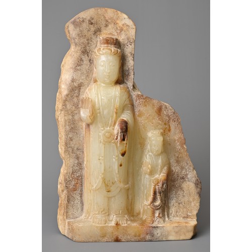 40 - A CHINESE JADE STONE BUDDHIST PART VOTIVE STELE, QI STYLE. Depicting two standing Buddhas dressed in... 