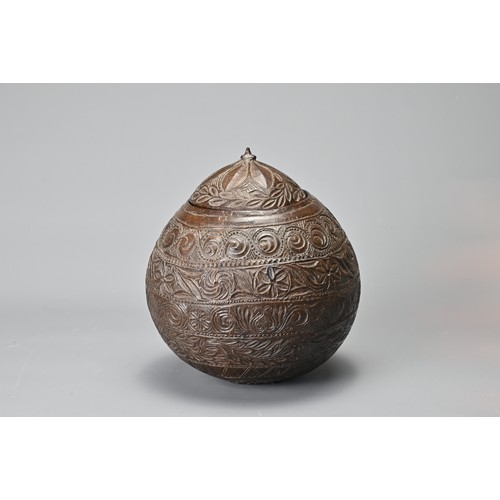 42 - AN ANGLO INDIAN CARVED COCONUT TEA CADDY, 19/20TH CENTURY. With bands of floral decoration in relief... 