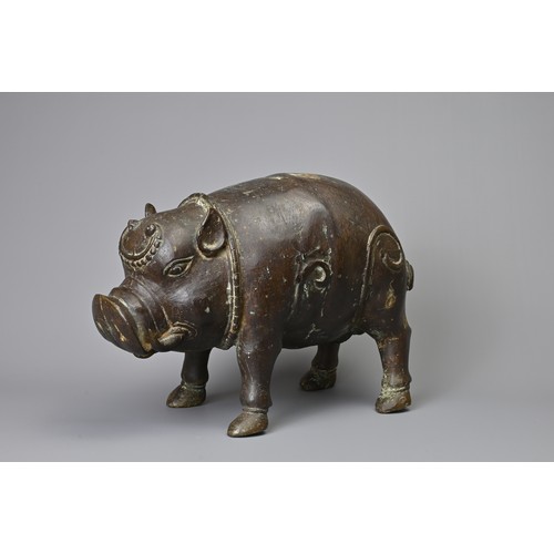 43 - A BALINESE VINTAGE BRONZE MODEL OF A PIG. Hollow cast model standing foursquare. 29cm length.