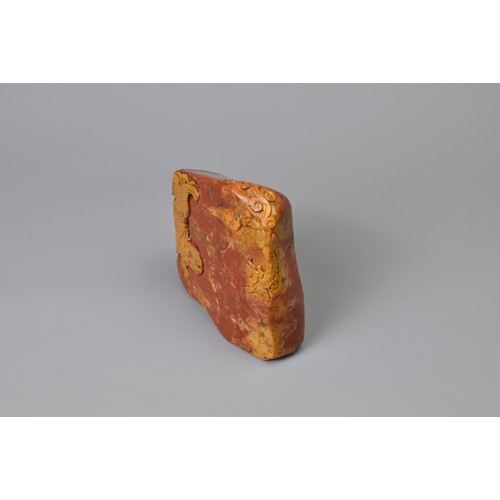 84 - A CHINESE CARVED SOAPSTONE SEAL, QING DYNASTY. Orange and red tones of boulder form carved in relief... 