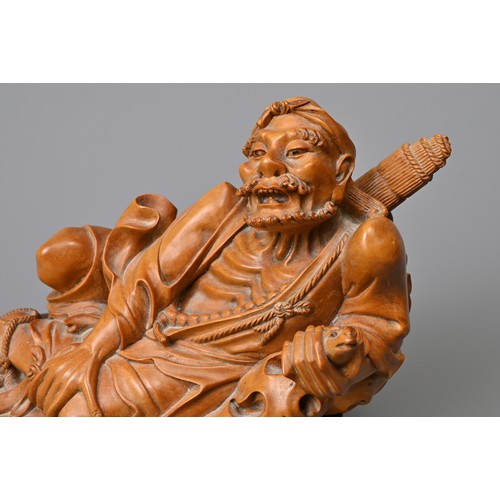 83 - A JAPANESE CARVED BOXWOOD FIGURE ON STAND, 19TH CENTURY. Well carved depicting a man wearing one rop... 