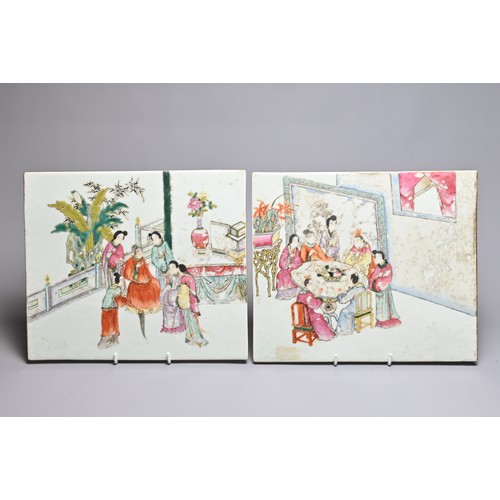 49 - A PAIR OF CHINESE FAMILLE ROSE PORCELAIN PLAQUES, LATE QING DYNASTY. The first with figures seated a... 