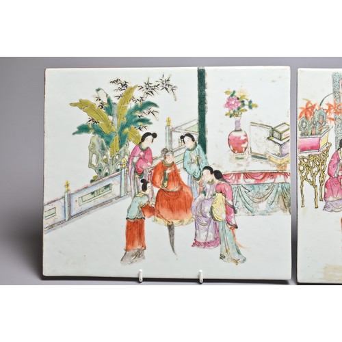 49 - A PAIR OF CHINESE FAMILLE ROSE PORCELAIN PLAQUES, LATE QING DYNASTY. The first with figures seated a... 