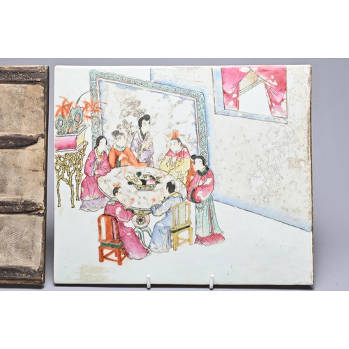 49 - A PAIR OF CHINESE FAMILLE ROSE PORCELAIN PLAQUES, LATE QING DYNASTY. The first with figures seated a... 