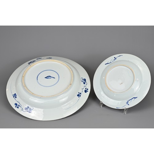 53 - TWO CHINESE BLUE AND WHITE DISHES, 18TH CENTURY. To include a large Kangxi (1662-1722) deep dish wit... 