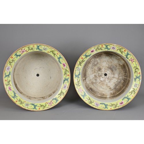 81 - A LARGE PAIR OF CHINESE LIME GREEN GROUND FAMILLE ROSE PORCELAIN JARDINIERES. Of cylindrical form wi... 