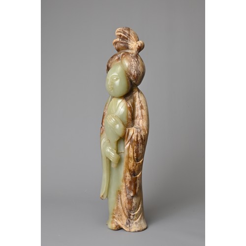 91 - A CHINESE CELADON JADE FIGURE OF A LADY HOLDING A FAN. Dressed in a long robe with hair tied up clas... 