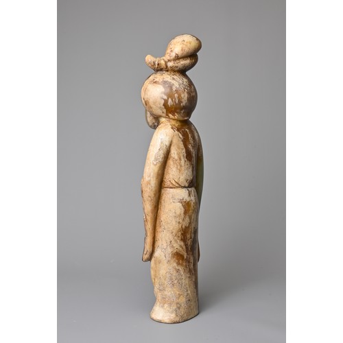 91 - A CHINESE CELADON JADE FIGURE OF A LADY HOLDING A FAN. Dressed in a long robe with hair tied up clas... 