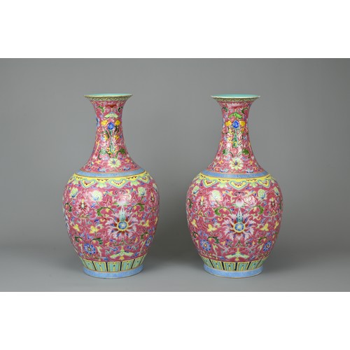 28 - A PAIR OF CHINESE RUBY GROUND PORCELAIN VASES, DAOGUANG MARK. Decorated in famille rose enamels with... 