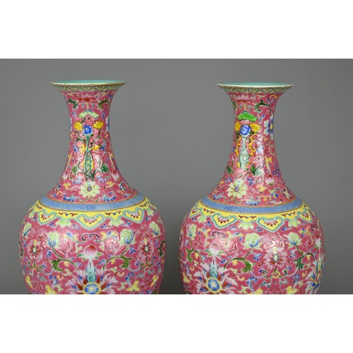 28 - A PAIR OF CHINESE RUBY GROUND PORCELAIN VASES, DAOGUANG MARK. Decorated in famille rose enamels with... 