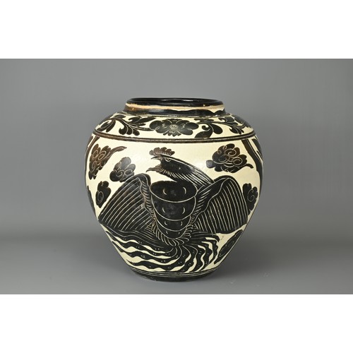 62 - A LARGE CHINESE CIZHOU TYPE DRAGON AND PHOENIX JAR. Sgraffito decorated black and cream coloured gla... 