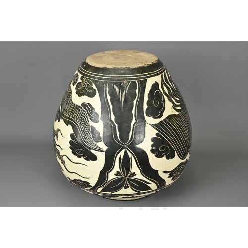 62 - A LARGE CHINESE CIZHOU TYPE DRAGON AND PHOENIX JAR. Sgraffito decorated black and cream coloured gla... 