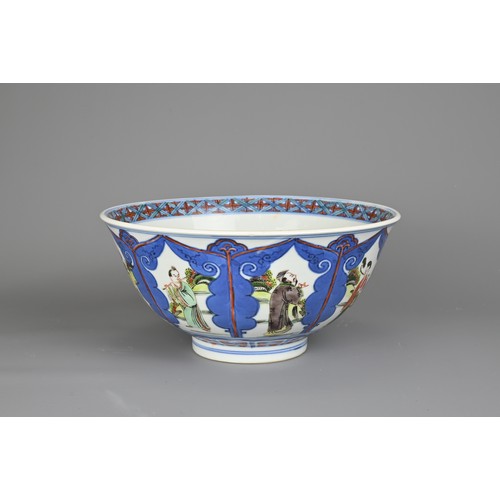 69 - A CHINESE WUCAI PORCELAIN IMMORTALS BOWL, WANLI MARK. Decorated with floral medallion to the interio... 