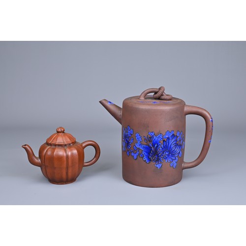 79 - TWO CHINESE TAIWAN YIXING POTTERY TEA POTS, 20TH CENTURY. A cylindrical form teapot with blue enamel... 