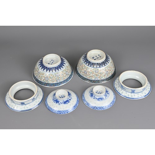 98 - A PAIR OF CHINESE PORCELAIN RICE GRAIN BOWLS, KANGXI MARK, LATE QING DYNASTY. Each bowl decorated in... 