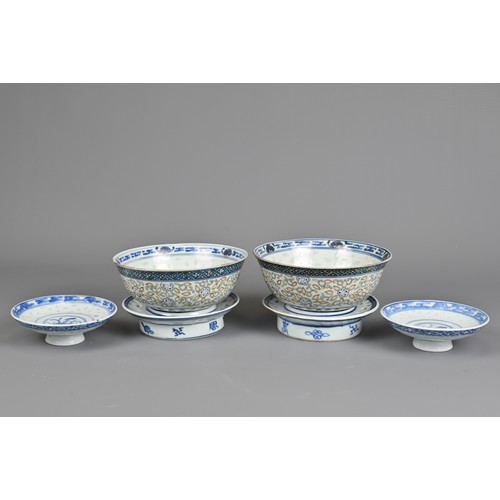 98 - A PAIR OF CHINESE PORCELAIN RICE GRAIN BOWLS, KANGXI MARK, LATE QING DYNASTY. Each bowl decorated in... 