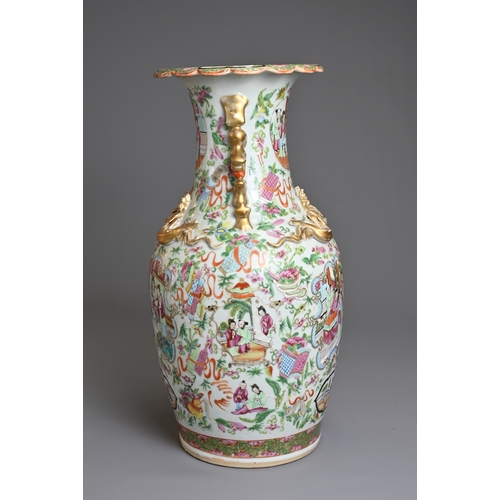 1 - A CHINESE CANTON FAMILLE ROSE PORCELAIN VASE, 19TH CENTURY. Of baluster form decorated with figures ... 