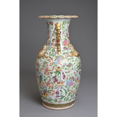 1 - A CHINESE CANTON FAMILLE ROSE PORCELAIN VASE, 19TH CENTURY. Of baluster form decorated with figures ... 