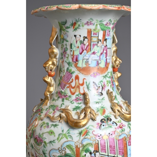 1 - A CHINESE CANTON FAMILLE ROSE PORCELAIN VASE, 19TH CENTURY. Of baluster form decorated with figures ... 