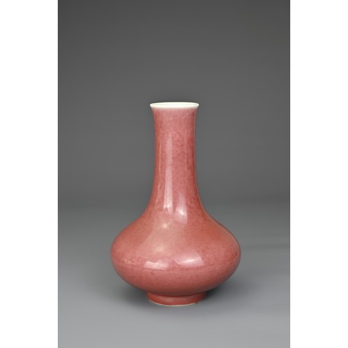 5 - A CHINESE PEACHBLOOM GLAZED PORCELAIN BOTTLE VASE, QIANLONG MARK. Compressed pear shaped body with s... 