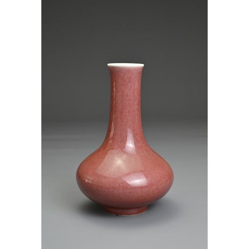 5 - A CHINESE PEACHBLOOM GLAZED PORCELAIN BOTTLE VASE, QIANLONG MARK. Compressed pear shaped body with s... 