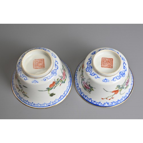 12 - A PAIR OF CHINESE FAMILLE ROSE CUPS AND STANDS, EARLY 20TH CENTURY. Finley potted cups with enamel d... 