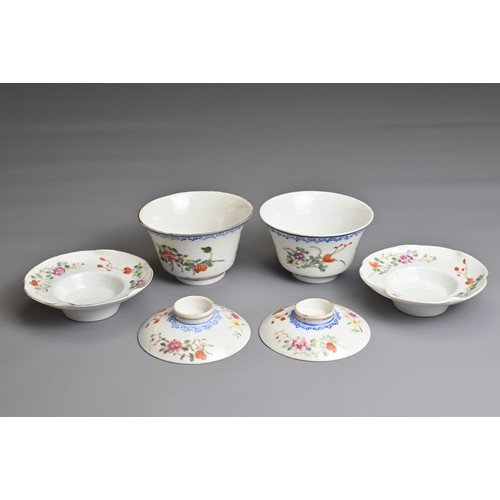 12 - A PAIR OF CHINESE FAMILLE ROSE CUPS AND STANDS, EARLY 20TH CENTURY. Finley potted cups with enamel d... 