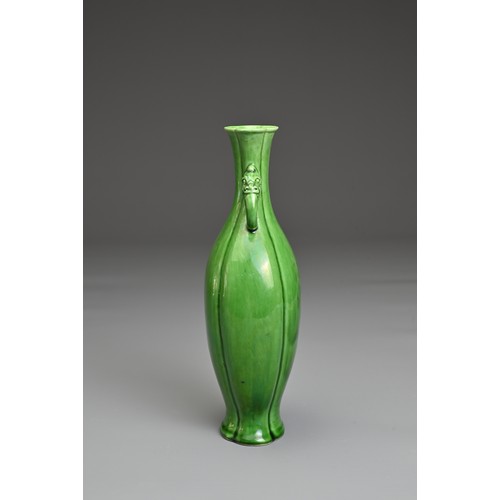 14 - A CHINESE GREEN GLAZED PORCELAIN VASE. Flattened baluster form with lobed body and rim in four secti... 