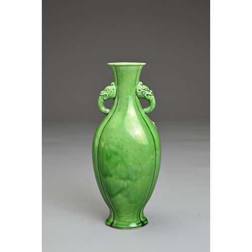 14 - A CHINESE GREEN GLAZED PORCELAIN VASE. Flattened baluster form with lobed body and rim in four secti... 