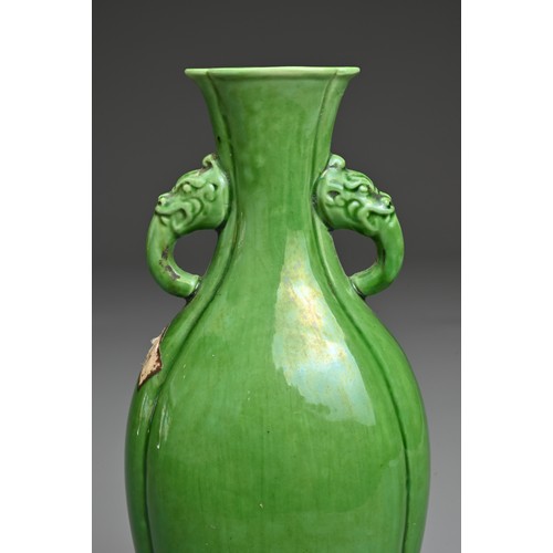 14 - A CHINESE GREEN GLAZED PORCELAIN VASE. Flattened baluster form with lobed body and rim in four secti... 