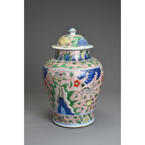 17 - A CHINESE WUCAI PORCELAIN HORSE JAR AND COVER, QING DYNASTY 17TH CENTURY. Of baluster form with wide... 