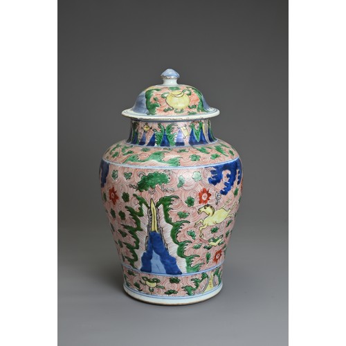 17 - A CHINESE WUCAI PORCELAIN HORSE JAR AND COVER, QING DYNASTY 17TH CENTURY. Of baluster form with wide... 