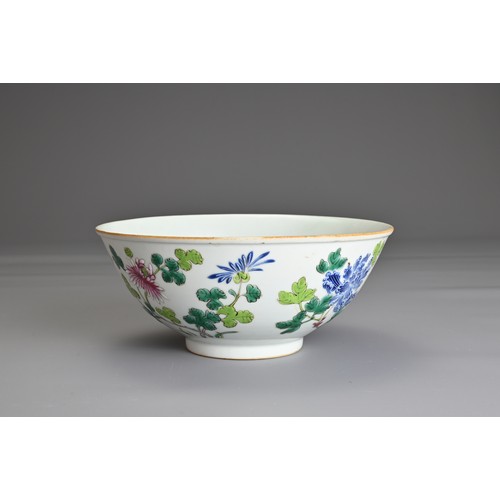 22 - A CHINESE FAMILLE ROSE PORCELAIN BOWL, 19TH CENTURY. Decorated in vibrant enamels with prunus, chrys... 