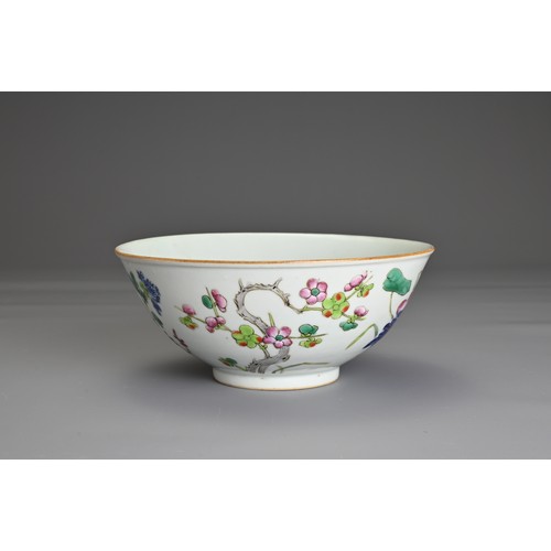 22 - A CHINESE FAMILLE ROSE PORCELAIN BOWL, 19TH CENTURY. Decorated in vibrant enamels with prunus, chrys... 