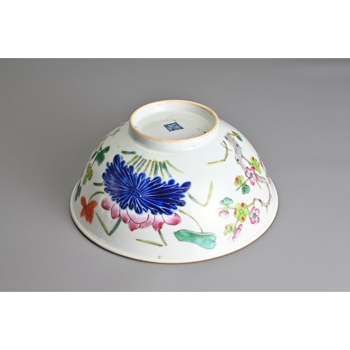 22 - A CHINESE FAMILLE ROSE PORCELAIN BOWL, 19TH CENTURY. Decorated in vibrant enamels with prunus, chrys... 