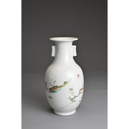 23 - A CHINESE FAMILLE ROSE PORCELAIN VASE, 20TH CENTURY.  Of baluster form with tubular handles decorate... 