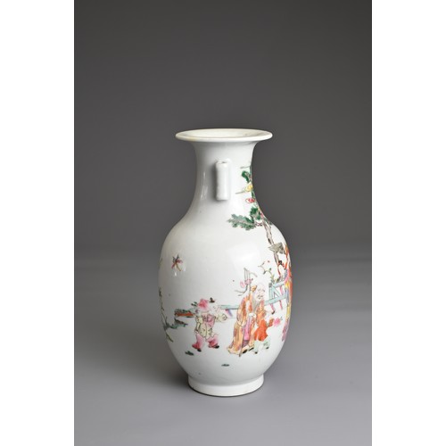 23 - A CHINESE FAMILLE ROSE PORCELAIN VASE, 20TH CENTURY.  Of baluster form with tubular handles decorate... 