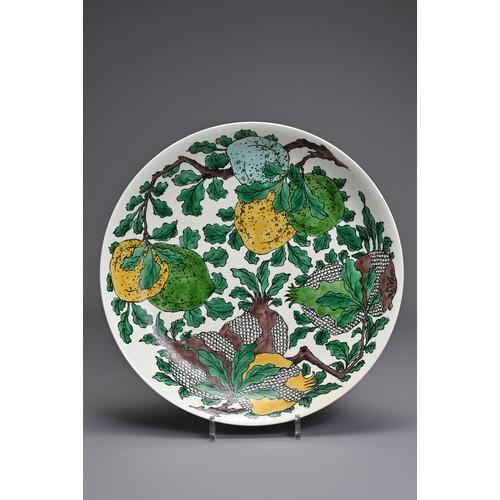 30 - A CHINESE BISCUIT ENAMELLED SANCAI PORCELAIN DISH, KANGXI MARK. Creamy white glazed porcelain body i... 